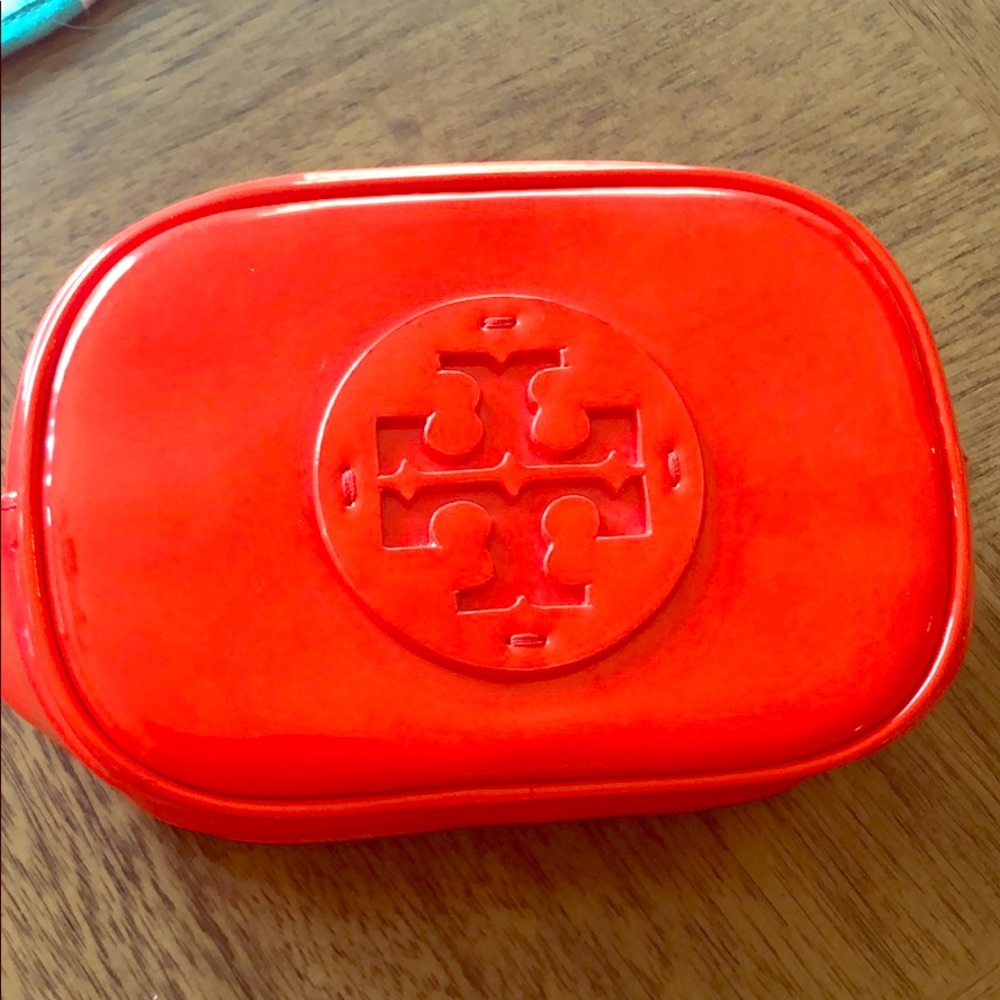Used Tory Burch makeup bag. Red patent leather.